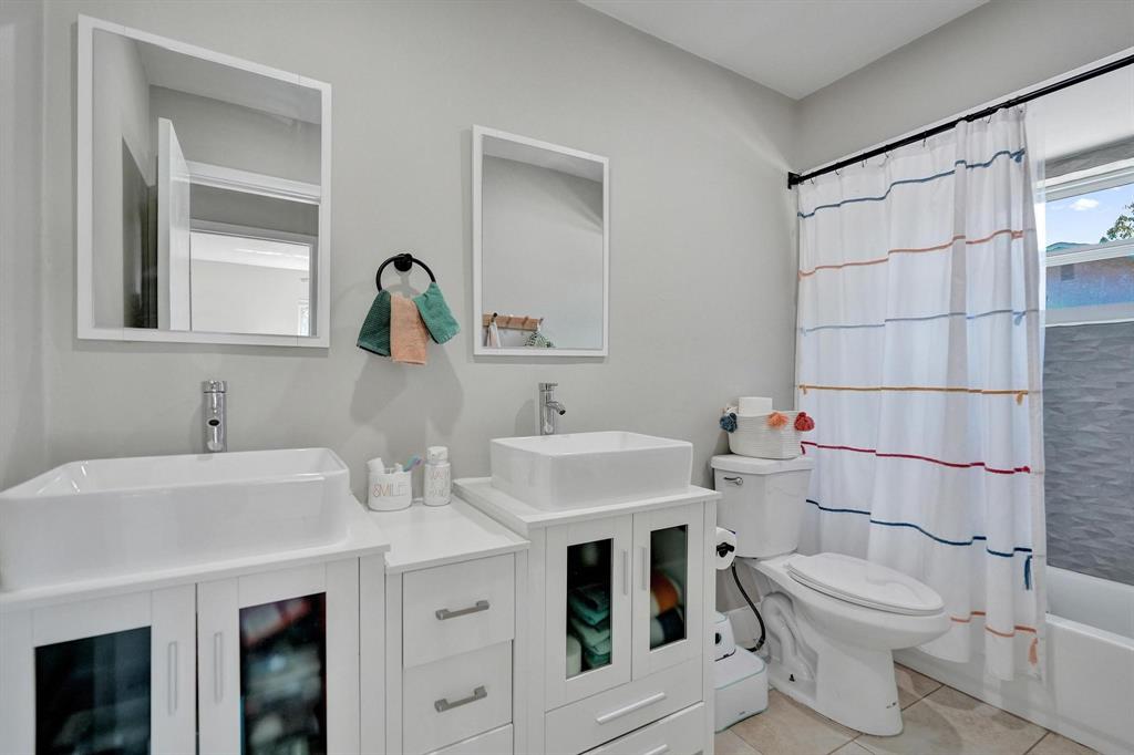 6411 Southwest 6th Street Margate, FL 33068 - Photo 31 of 48 a bathroom with a sink and a toilet