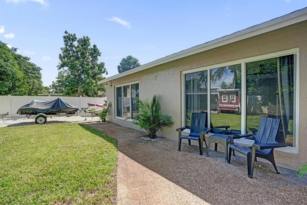 6411 Southwest 6th Street Margate, FL 33068 - Photo 35 of 48 a view of swimming pool with outdoor seating and a garden