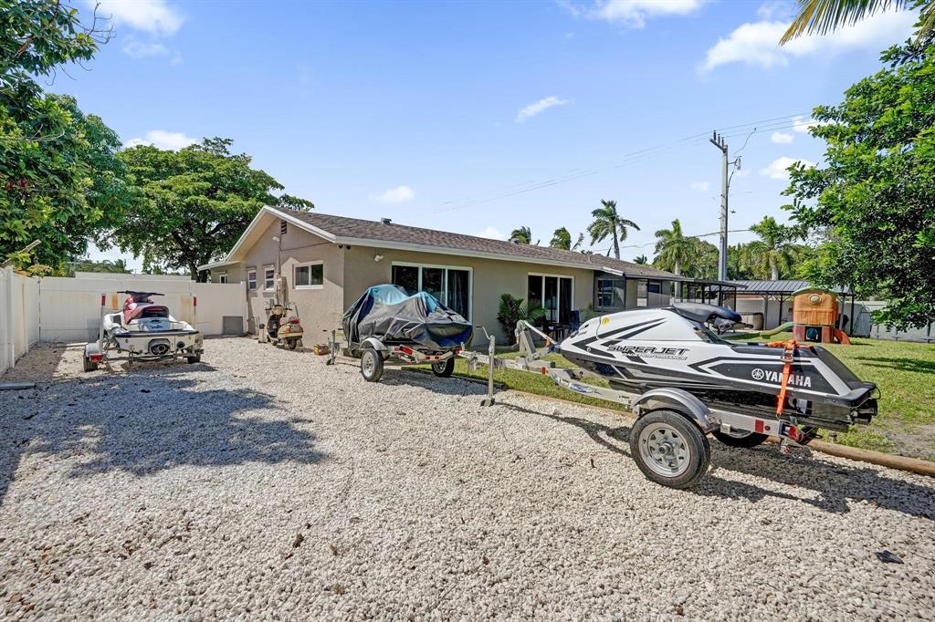 6411 Southwest 6th Street Margate, FL 33068 - Photo 41 of 48 a car parked in front of a house