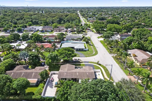 an aerial view of a swimming pool and outdoor space