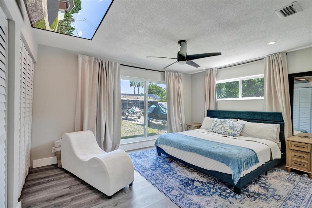 6411 Southwest 6th Street Margate, FL 33068 - Photo 6 of 48 a bedroom with a bed couch and window