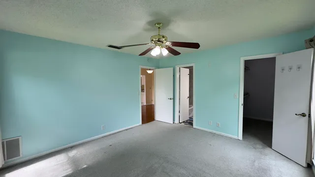 a view of a chandelier fan in a room