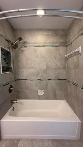 a bathroom with a shower and a bathtub