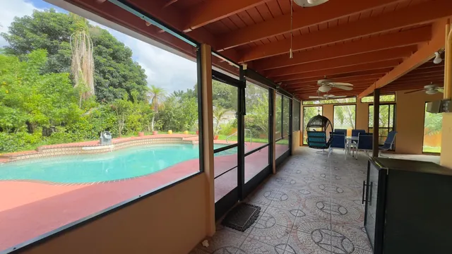 a view of a backyard of the house