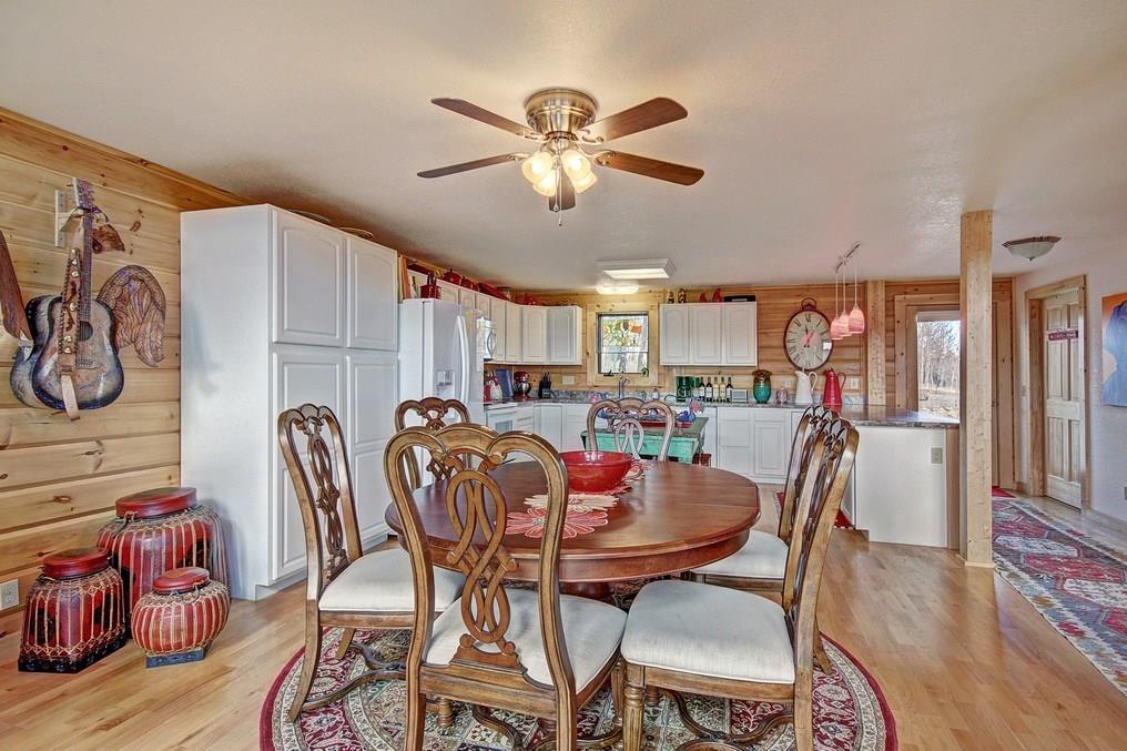 1092 Sheep Ridge Road Fairplay, CO 80440 - Photo 8 of 25 a view of a dining room with furniture window and wooden floor