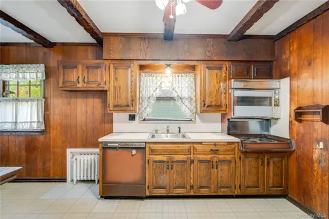 a kitchen with stainless steel appliances granite countertop a stove and a refrigerator