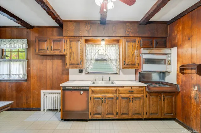a kitchen with stainless steel appliances granite countertop a stove and a refrigerator