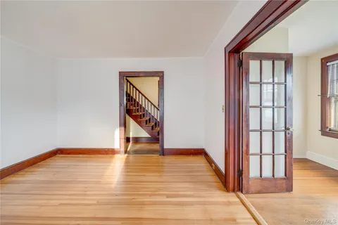 a view of an entryway with wooden floor