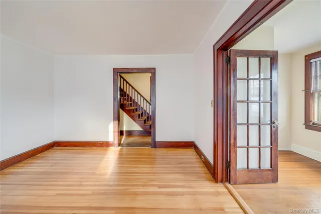 a view of an entryway with wooden floor