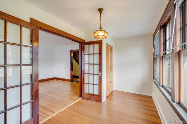 a view of an entryway with wooden floor
