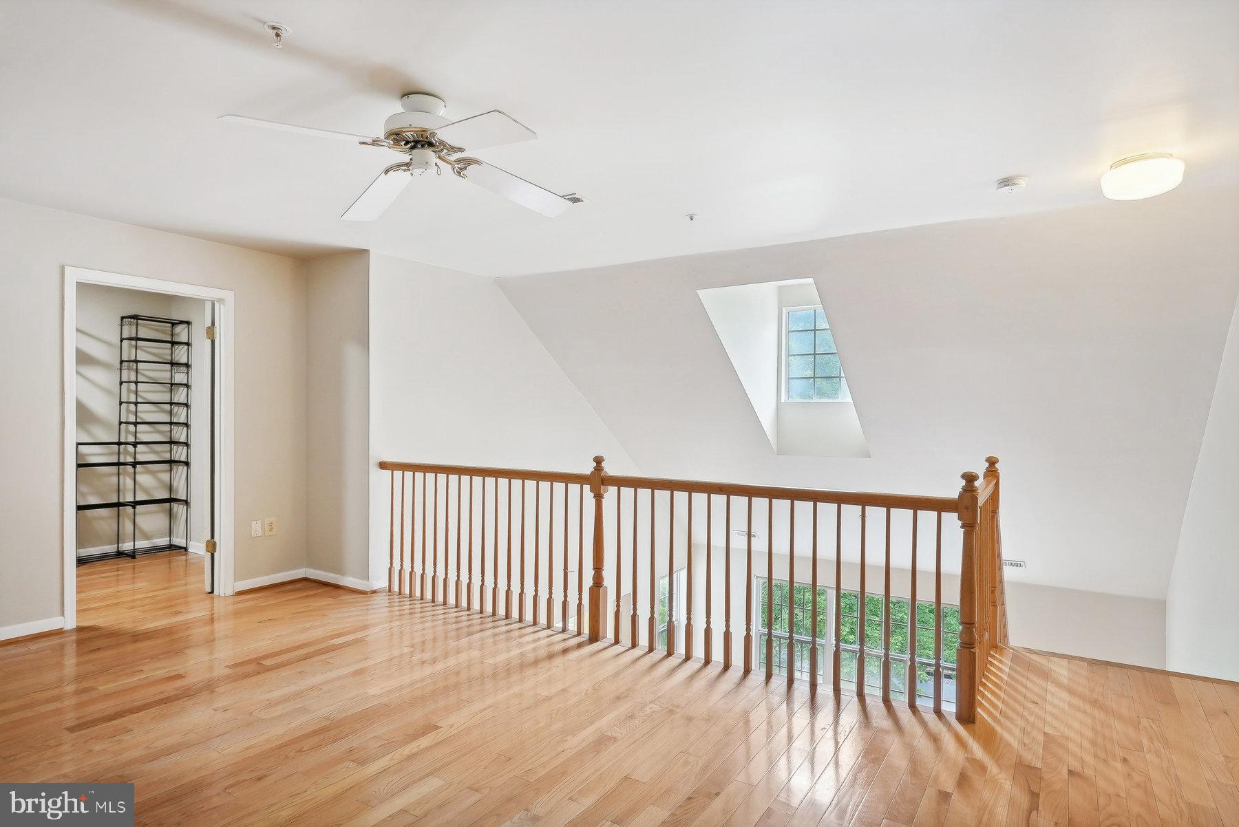624 Brickhouse Road Princeton, NJ 08540 - Photo 21 of 35 wooden floor in an empty room with a window