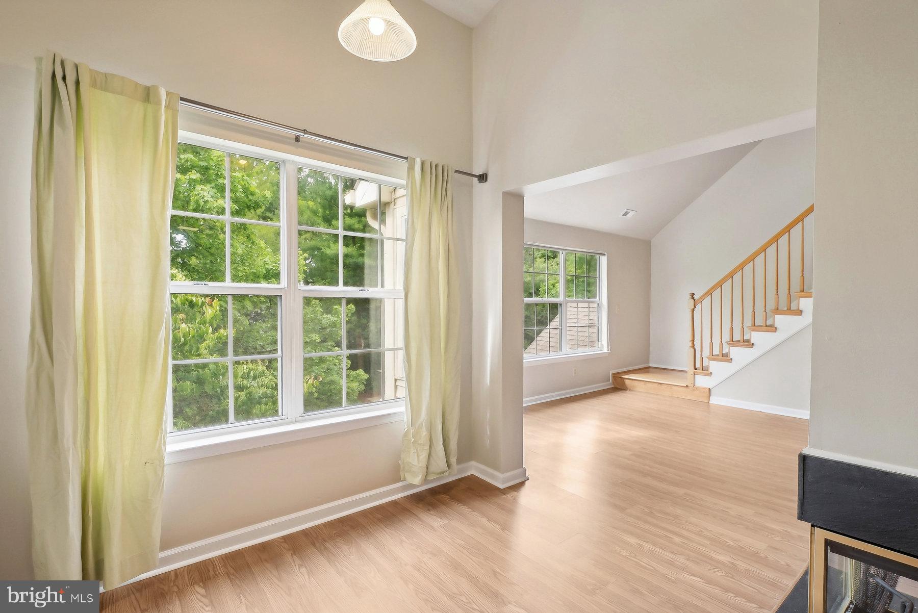 624 Brickhouse Road Princeton, NJ 08540 - Photo 5 of 35 a view of an empty room with wooden floor and a window