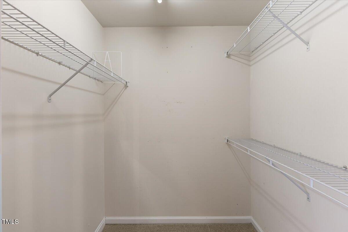 8123 Rhiannon Road Raleigh, NC 27613 - Photo 26 of 47 a view of a room with racks on the wall