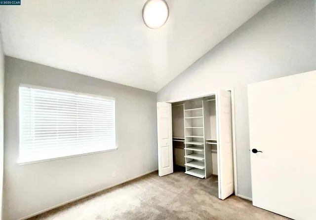 a view of an empty walk in closet