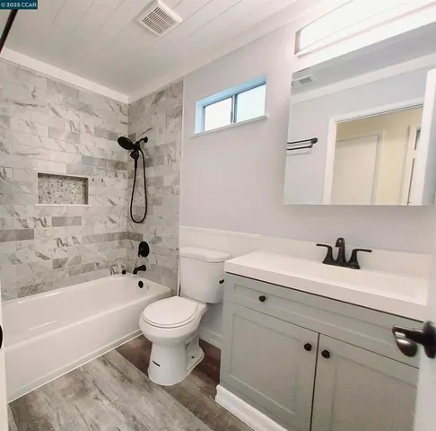 a view of backyard with a deck