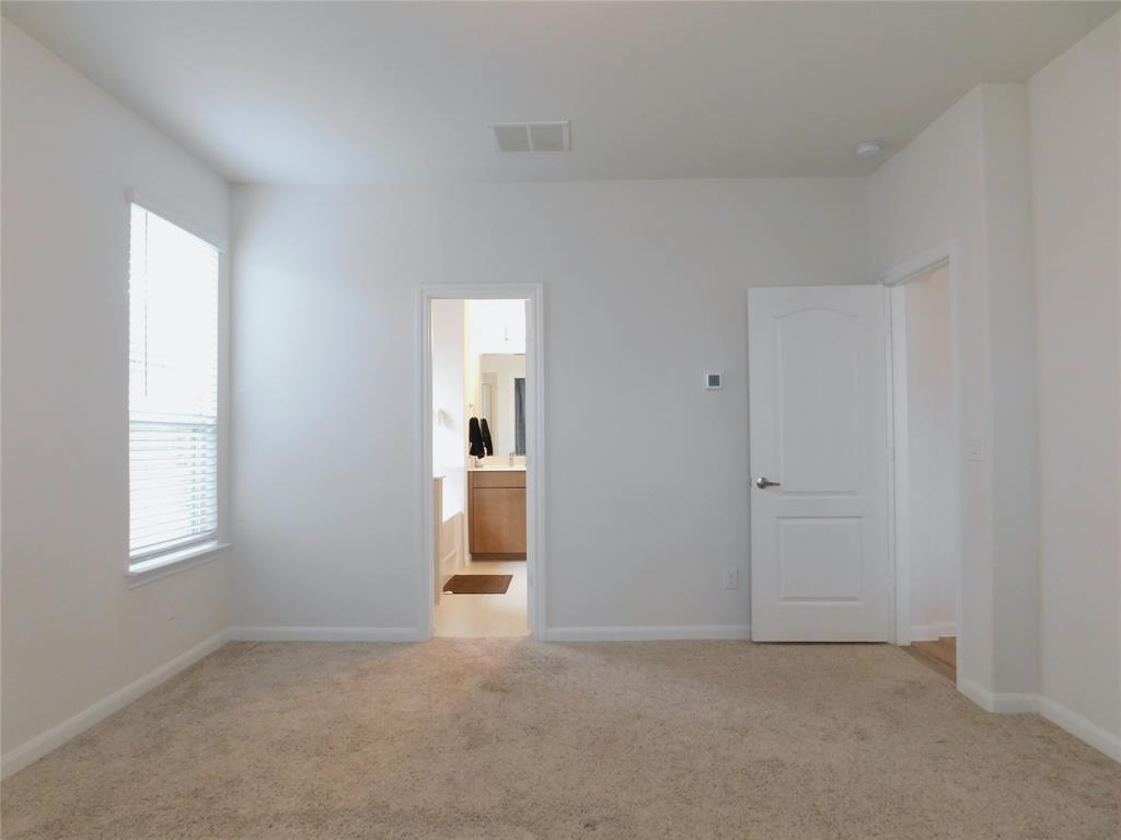 1111 Saddle Ridge Drive Aubrey, TX 76227 - Photo 14 of 35 an empty room with windows and closet
