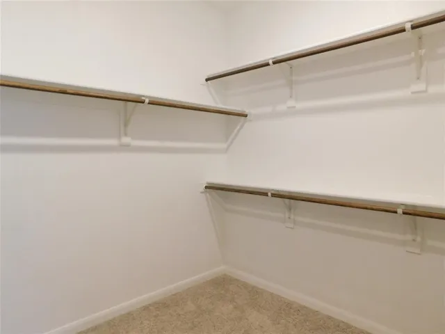 a view of an empty walk in closet