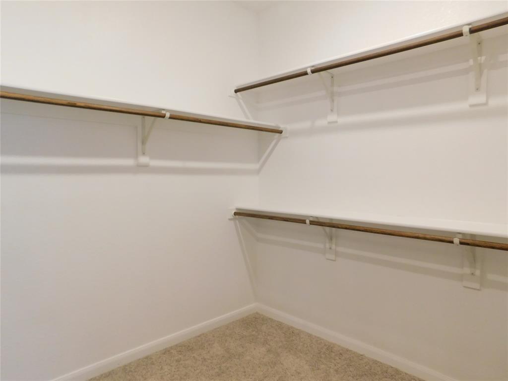 1111 Saddle Ridge Drive Aubrey, TX 76227 - Photo 18 of 35 a view of an empty walk in closet