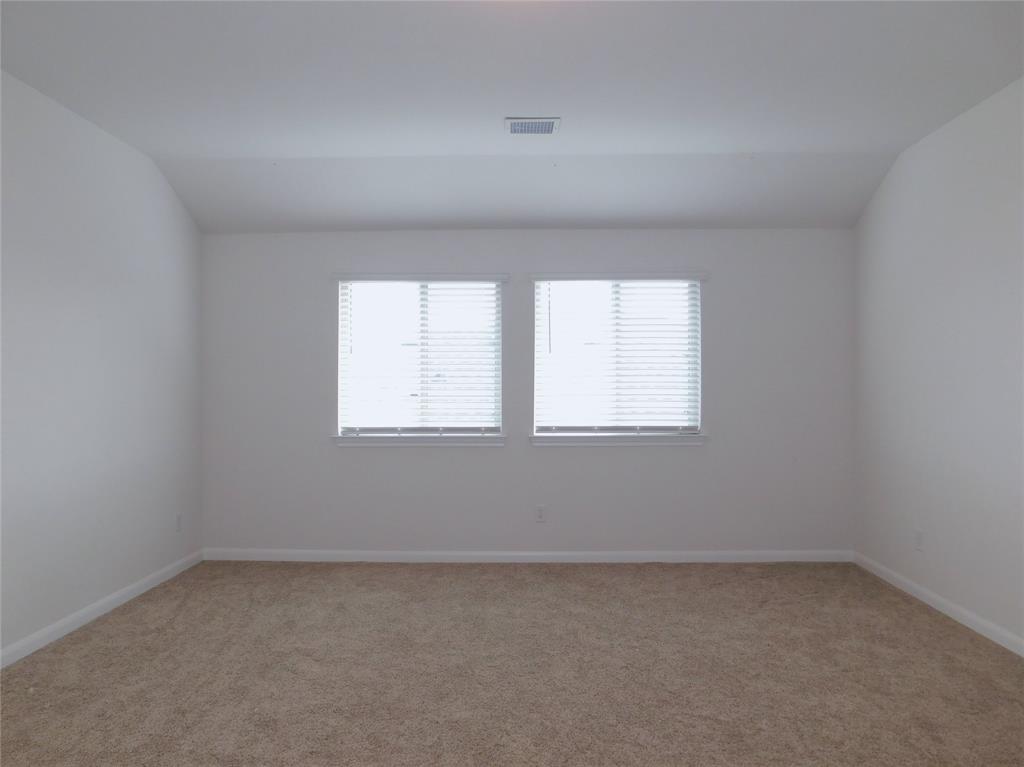 1111 Saddle Ridge Drive Aubrey, TX 76227 - Photo 21 of 35 an empty room with a window