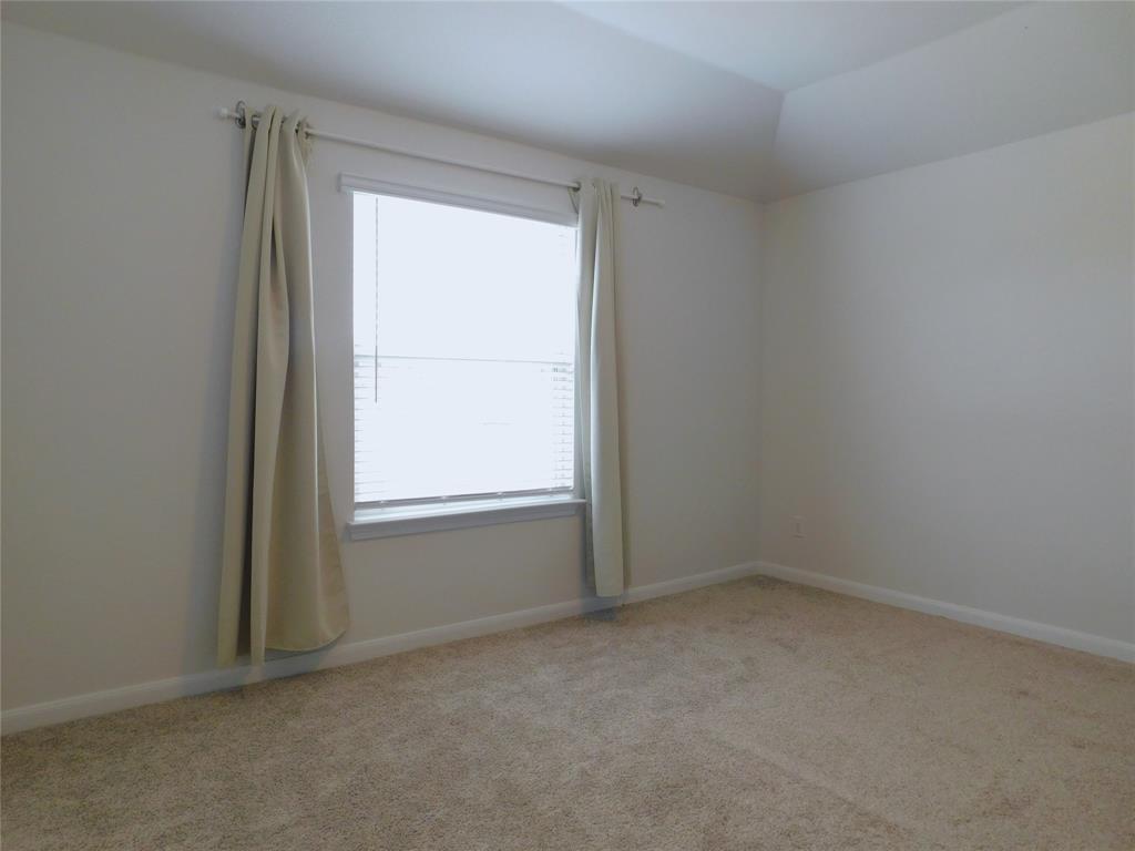 1111 Saddle Ridge Drive Aubrey, TX 76227 - Photo 25 of 35 an empty room with a window