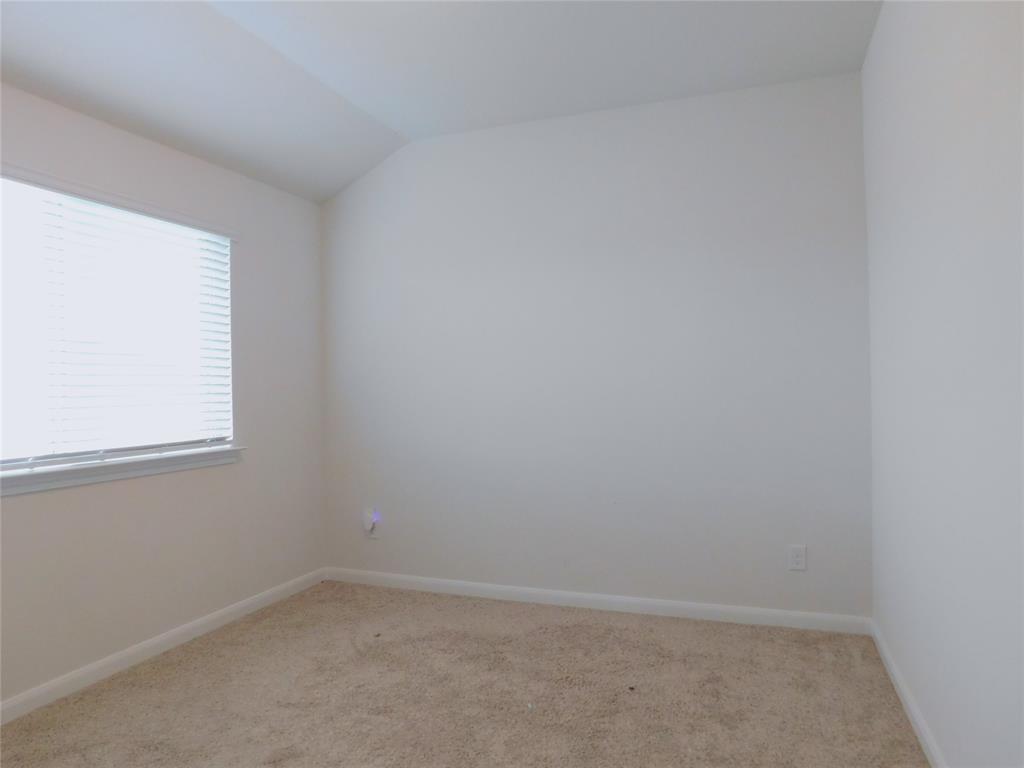 1111 Saddle Ridge Drive Aubrey, TX 76227 - Photo 27 of 35 an empty room with a window