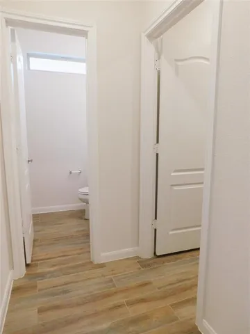 a bathroom with a sink toilet and a mirror