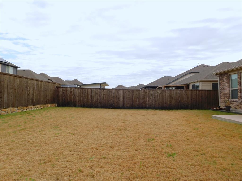 1111 Saddle Ridge Drive Aubrey, TX 76227 - Photo 34 of 35 a view of an outdoor space and yard