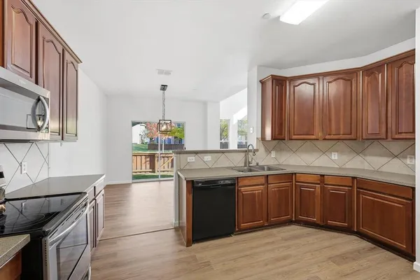 a kitchen with a sink and cabinets