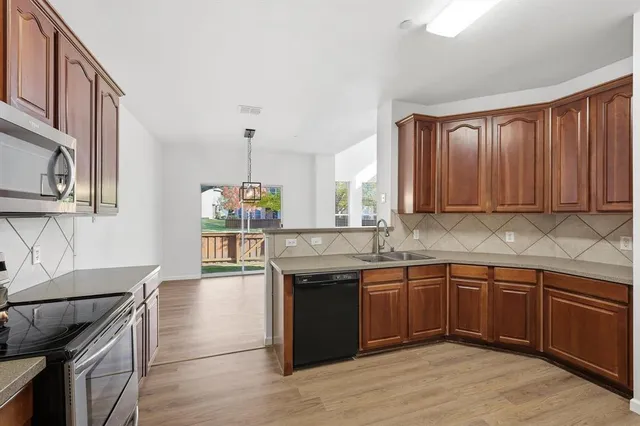a kitchen with a sink and cabinets