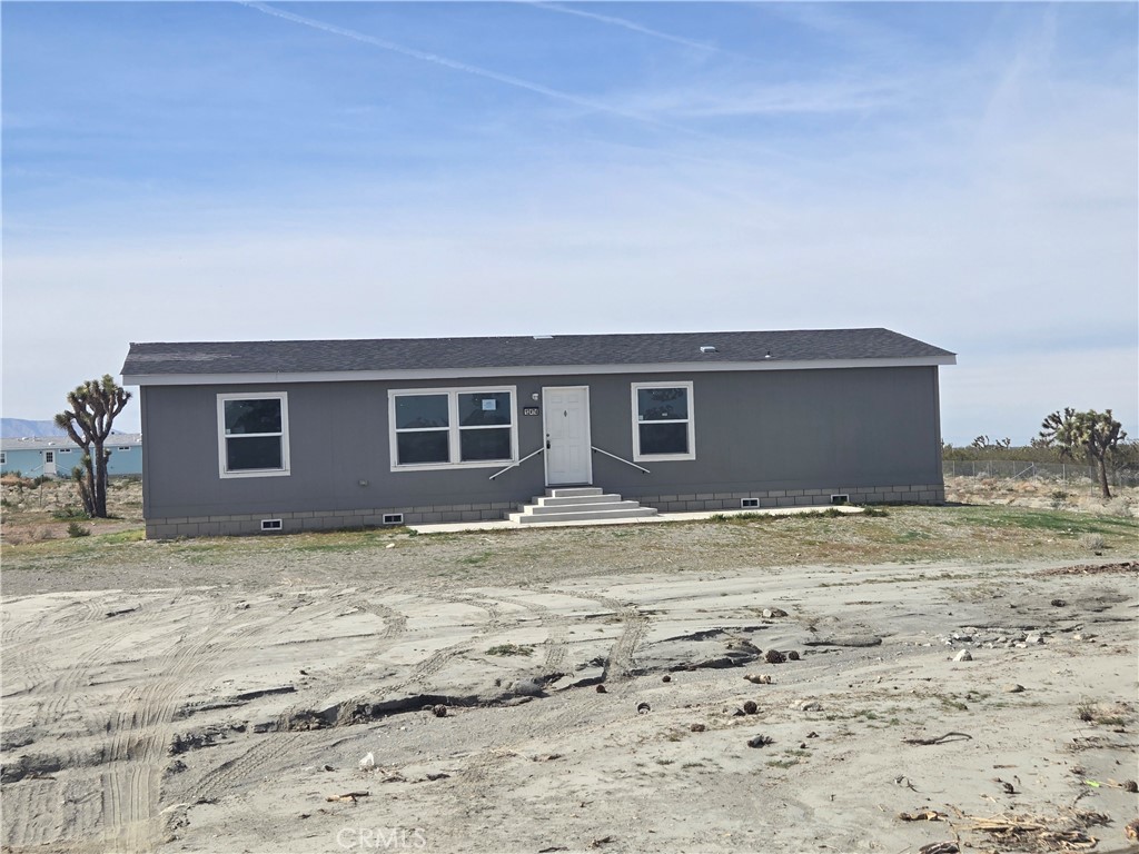 12474 Silver Rock Road Pinon Hills, CA 92372 - Photo 1 of 34 a view of a backyard of the house