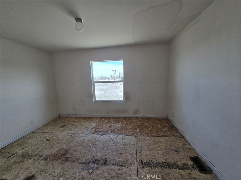 12474 Silver Rock Road Pinon Hills, CA 92372 - Photo 15 of 34 an empty room with a empty space and window