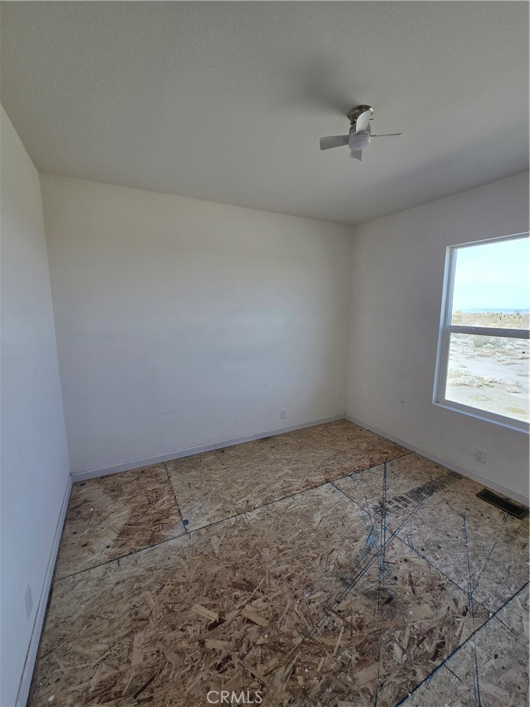 12474 Silver Rock Road Pinon Hills, CA 92372 - Photo 17 of 34 an empty room with a window