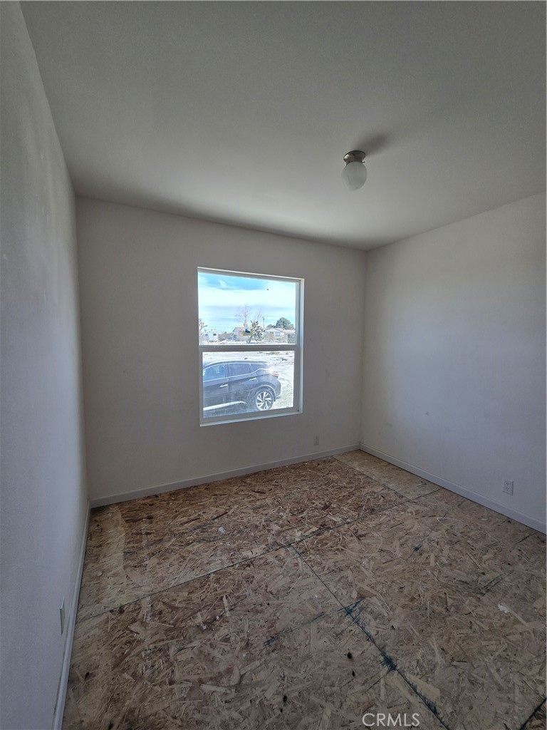 12474 Silver Rock Road Pinon Hills, CA 92372 - Photo 21 of 34 an empty room with windows
