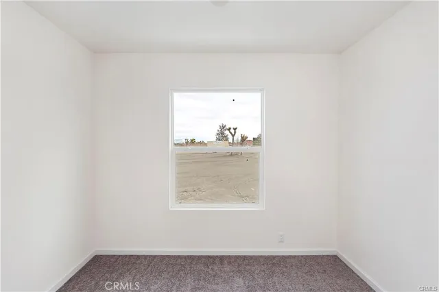 a utility room with wooden floor washer and dryer