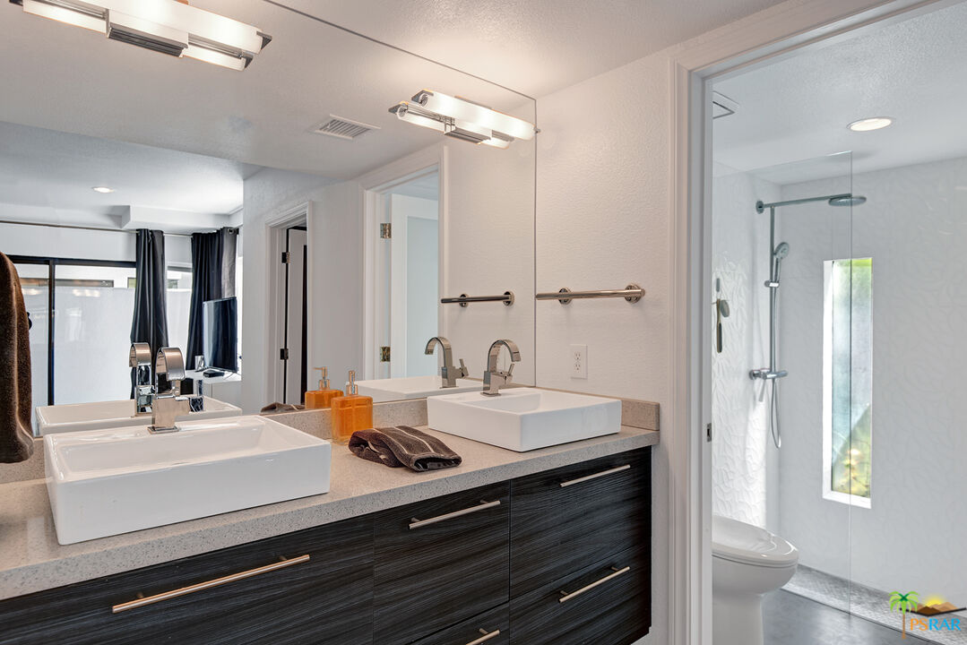 1530 North Kaweah Road Palm Springs, CA 92262 - Photo 20 of 42 a bathroom with a sink double vanity and a mirror