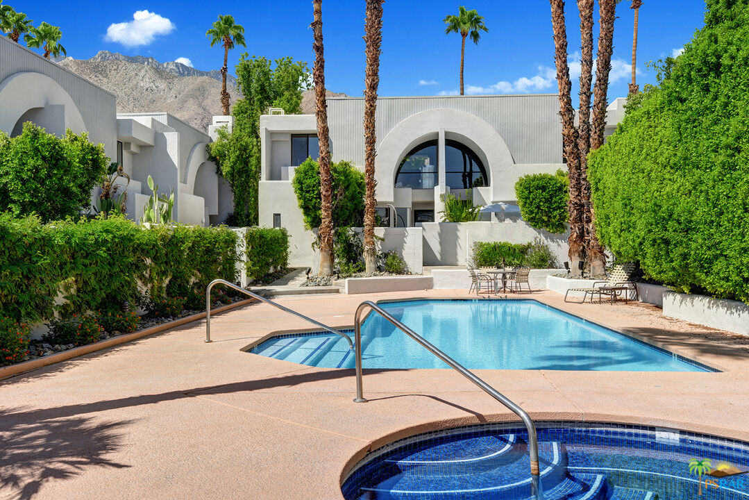 1530 North Kaweah Road Palm Springs, CA 92262 - Photo 38 of 42 a view of swimming pool with outdoor seating and plants