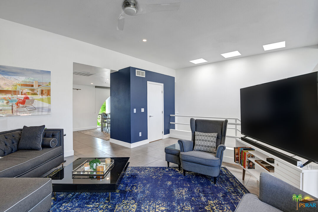 1530 North Kaweah Road Palm Springs, CA 92262 - Photo 4 of 42 a living room with furniture and a flat screen tv