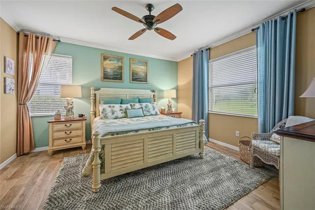 a bedroom with a bed and glass walk in closet