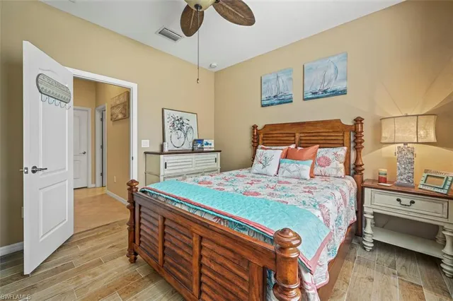 a bathroom with a granite countertop sink a toilet and a mirror