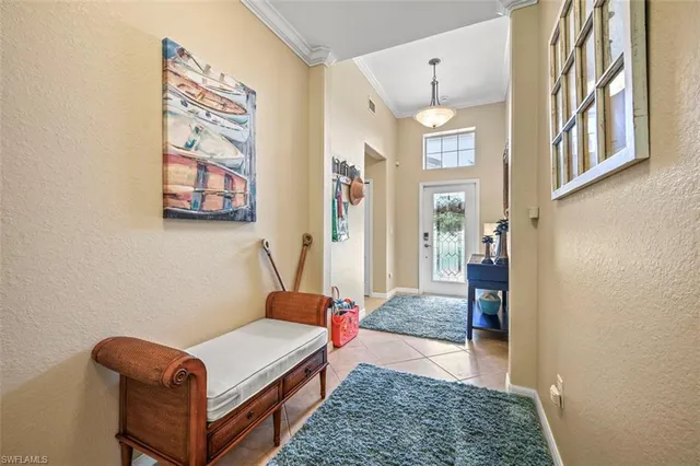 a kitchen with stainless steel appliances granite countertop a stove a refrigerator a kitchen island a sink and a refrigerator