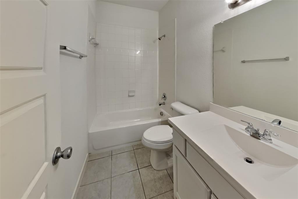 1538 Calcot Lane Forney, TX 75126 - Photo 15 of 21 a bathroom with a sink a toilet and shower