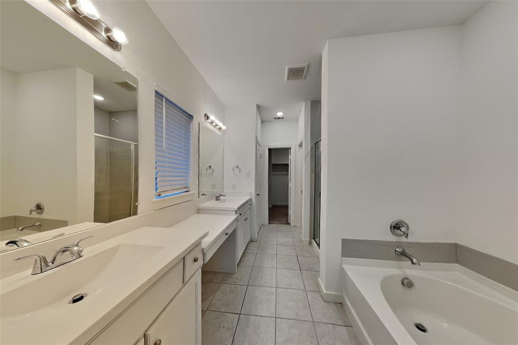 1538 Calcot Lane Forney, TX 75126 - Photo 8 of 21 a bathroom with a tub sink and mirror