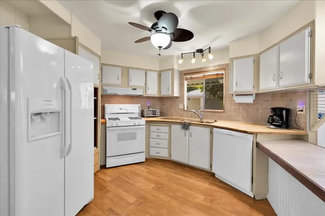 a view of storage and utility room with washer and dryer
