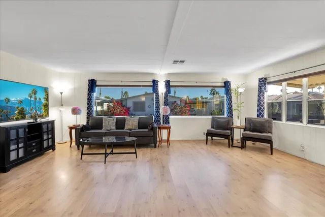 a view of a dining room with furniture wooden floor and a rug