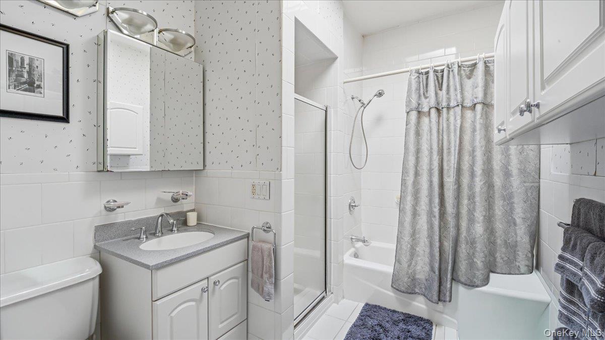 52-61 66th Street Queens, NY 11378 - Photo 19 of 26 a bathroom with a sink toilet and shower