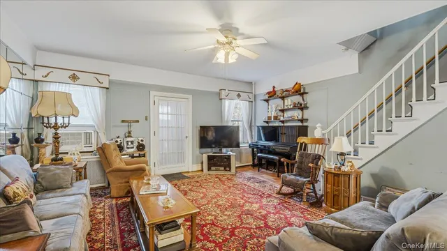 a living room with furniture fireplace and a flat screen tv