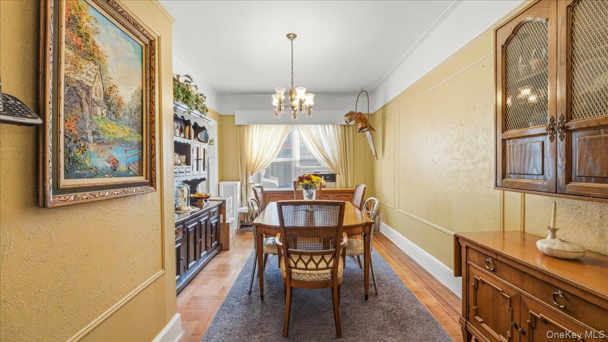 52-61 66th Street Queens, NY 11378 - Photo 4 of 26 a view of a dining room with furniture window and wooden floor