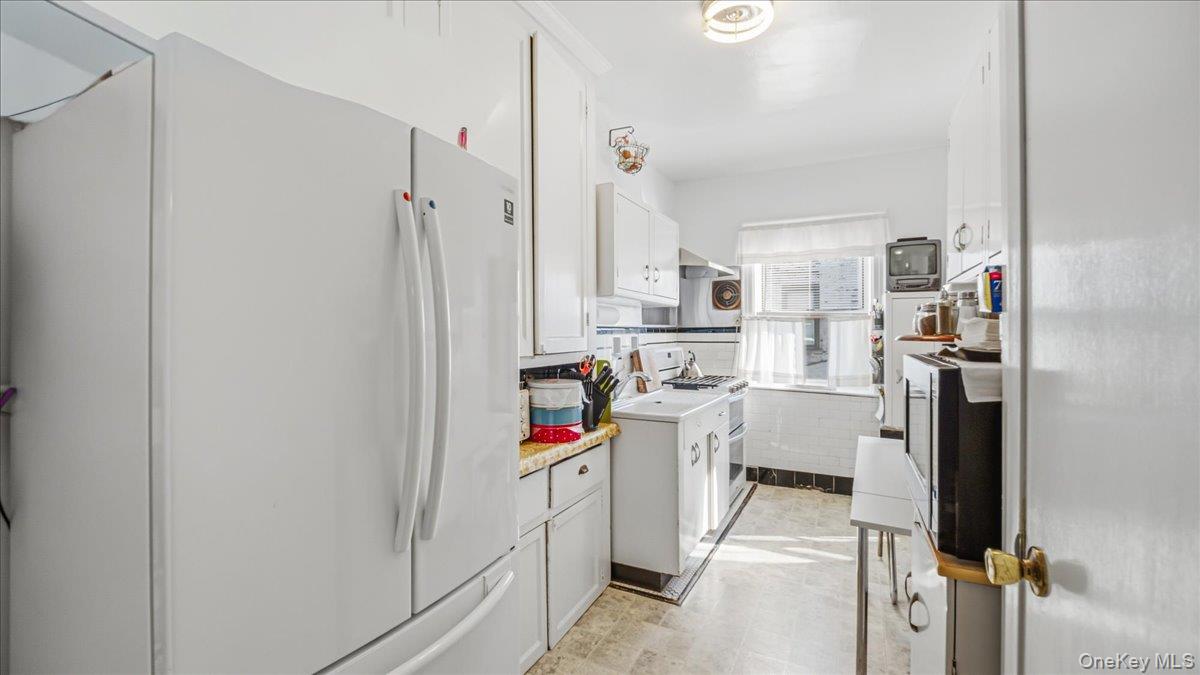 52-61 66th Street Queens, NY 11378 - Photo 8 of 26 a very nice looking open kitchen with stainless steel appliances