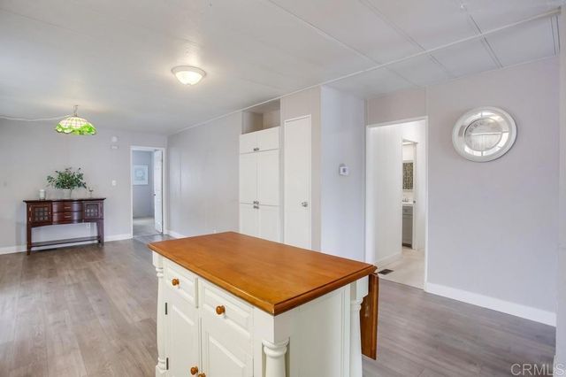 a view of a kitchen cabinets and wooden floor