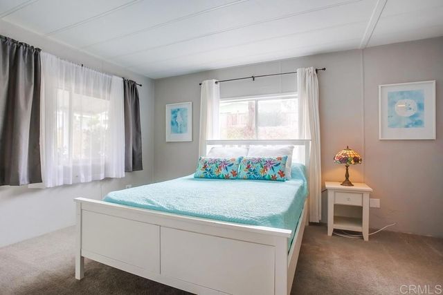 a room with a bed and a window